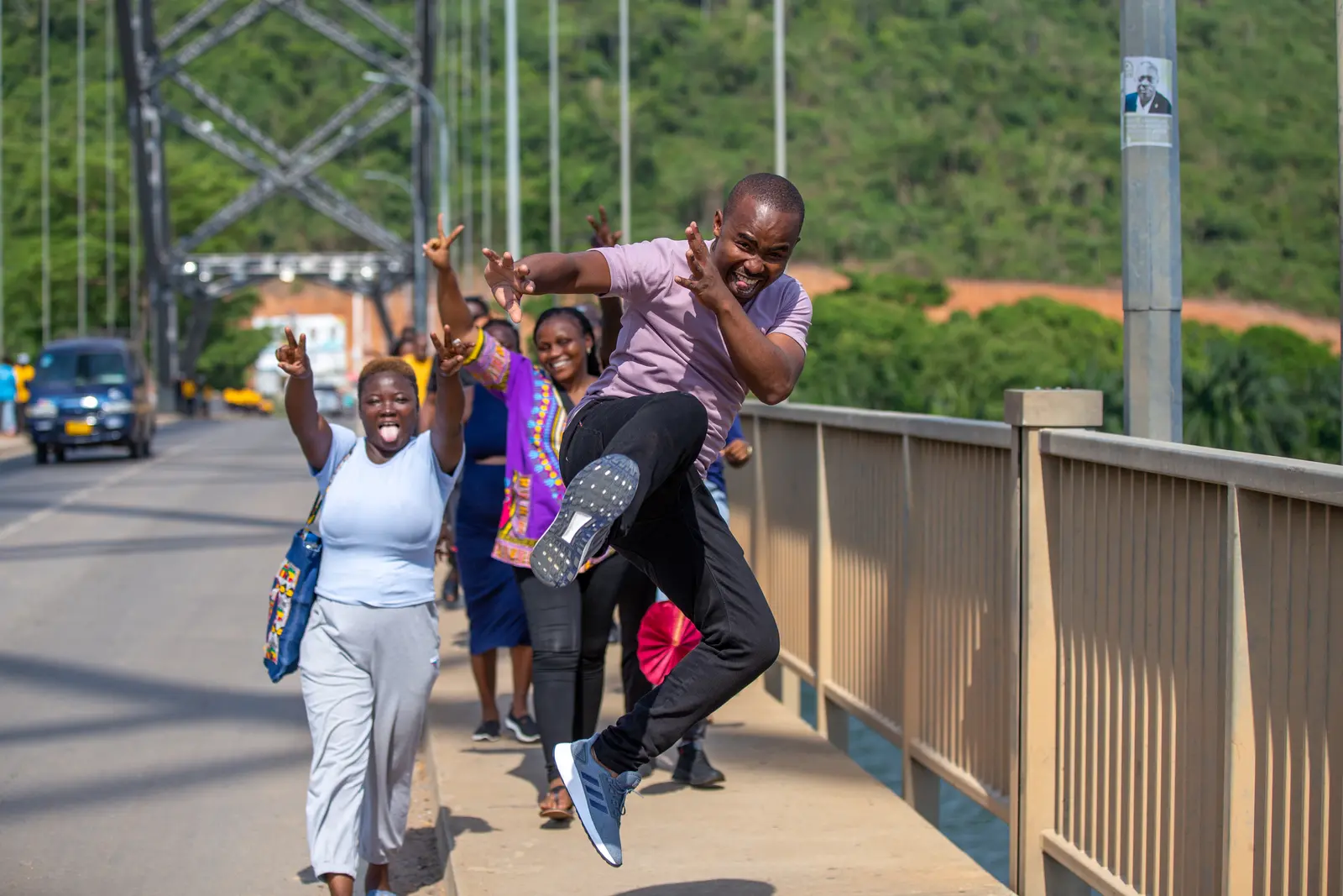 Participants crossing a pedestrian bridge together