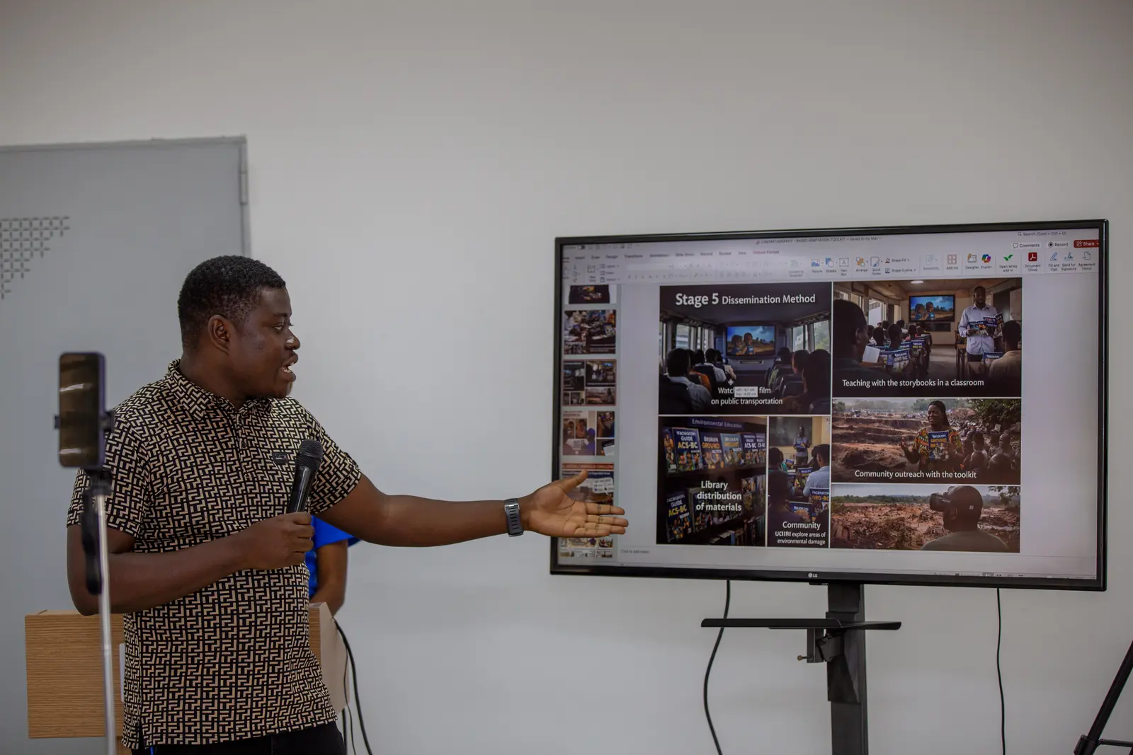 A facilitator presenting visual project material