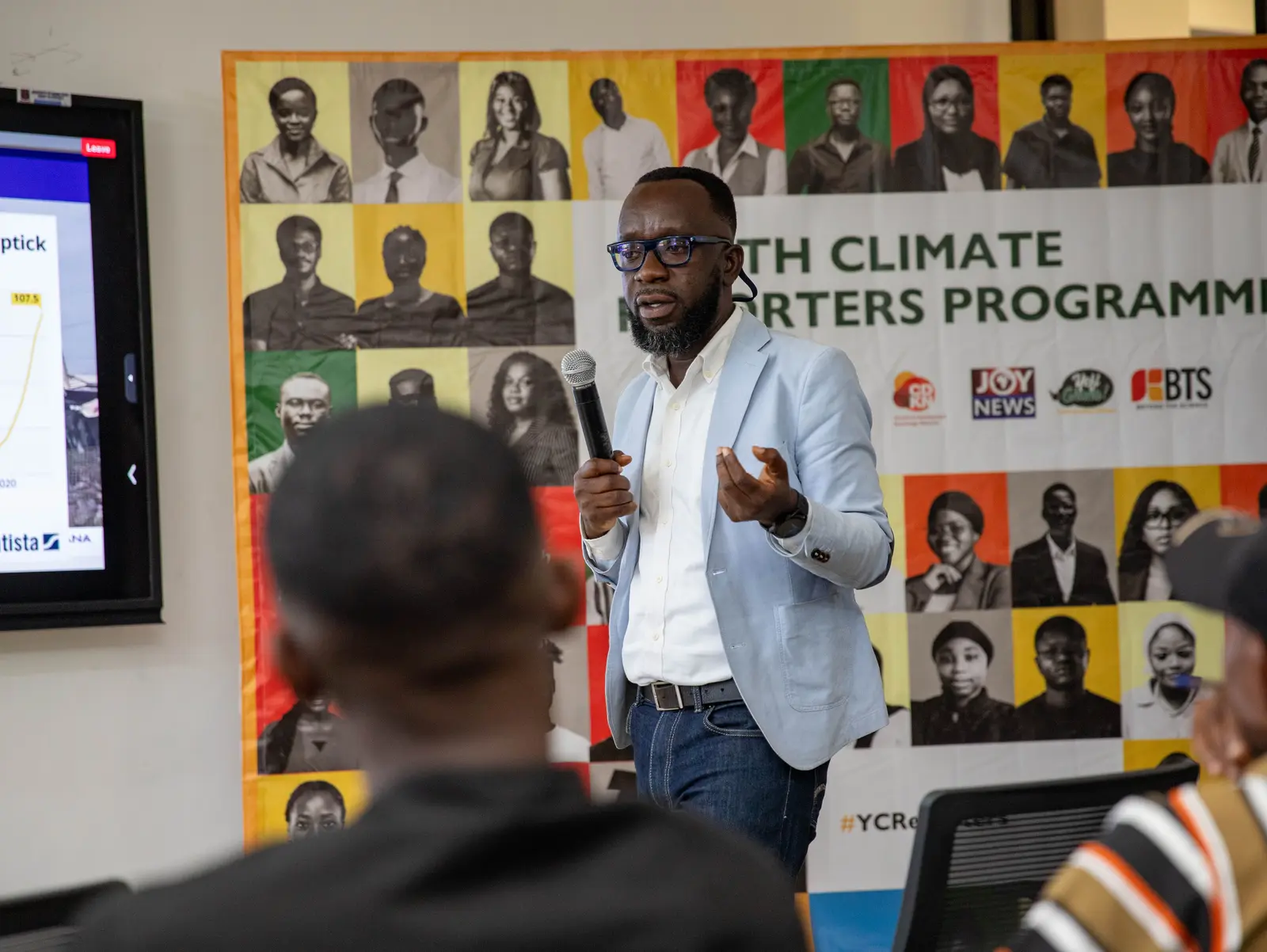 Speaker addressing youth climate reporters