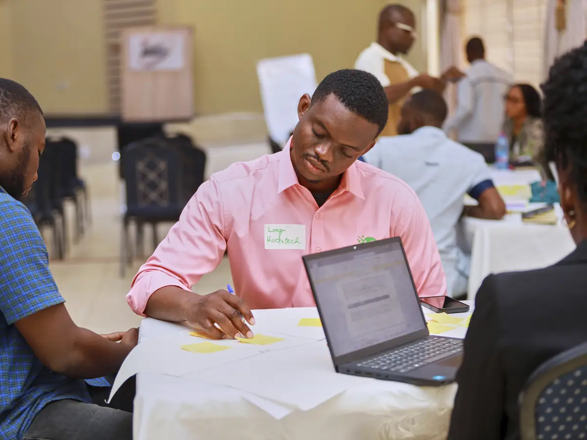 A participant developing a venture concept at a workshop